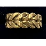 A 18 carat yellow gold ring. Size O. Weight 11gm.