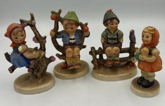 Four various Hummel/Goebel figurines.