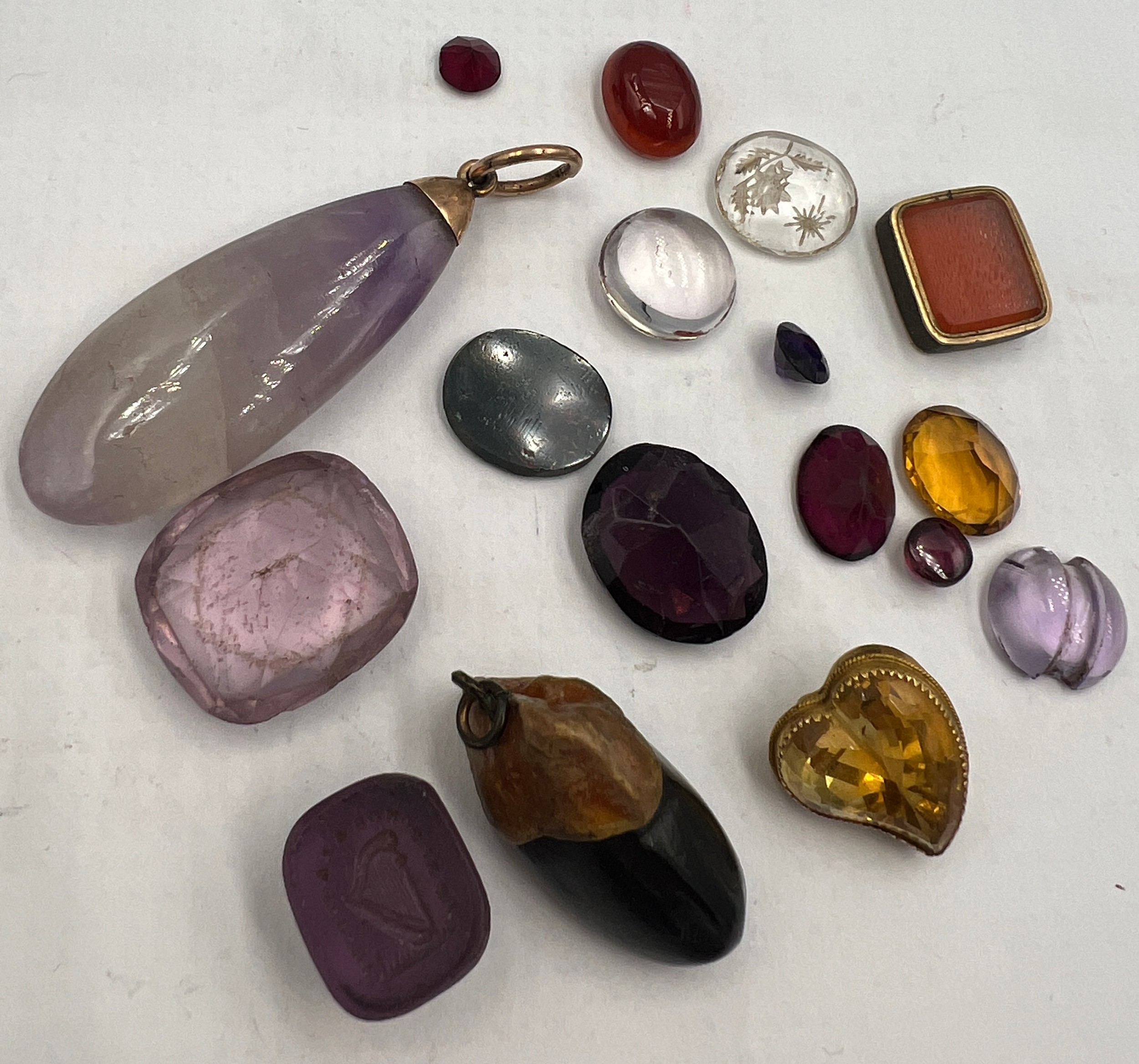 A quantity of stones to include amethyst, moss agate, citrine, seal etc.
