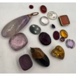 A quantity of stones to include amethyst, moss agate, citrine, seal etc.