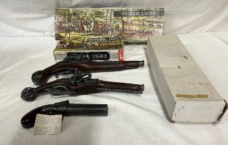 Three boxed antique pistol replicas, made in Spain.