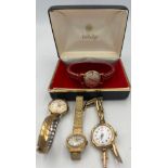 A 9 carat gold ladies vintage Verity wristwatch on a rolled gold strap, together with three