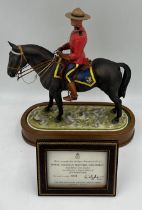 A Royal Worcester limited edition model of a Royal Canadian Mounted Policeman modelled by Doris
