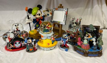 A collection of seven Disney snow globes to include 4 working musical ('Mickey Mouse March' x 3 plus