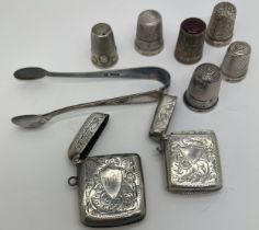 Silver to include 5 hallmarked silver thimbles, 1 with glass top, 1 white metal thimble, 2 vesta
