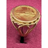 A 1986 Liberty Gold 5 Dollar coin ring set in 14 carat gold. Size O. Weight 7.8gm.