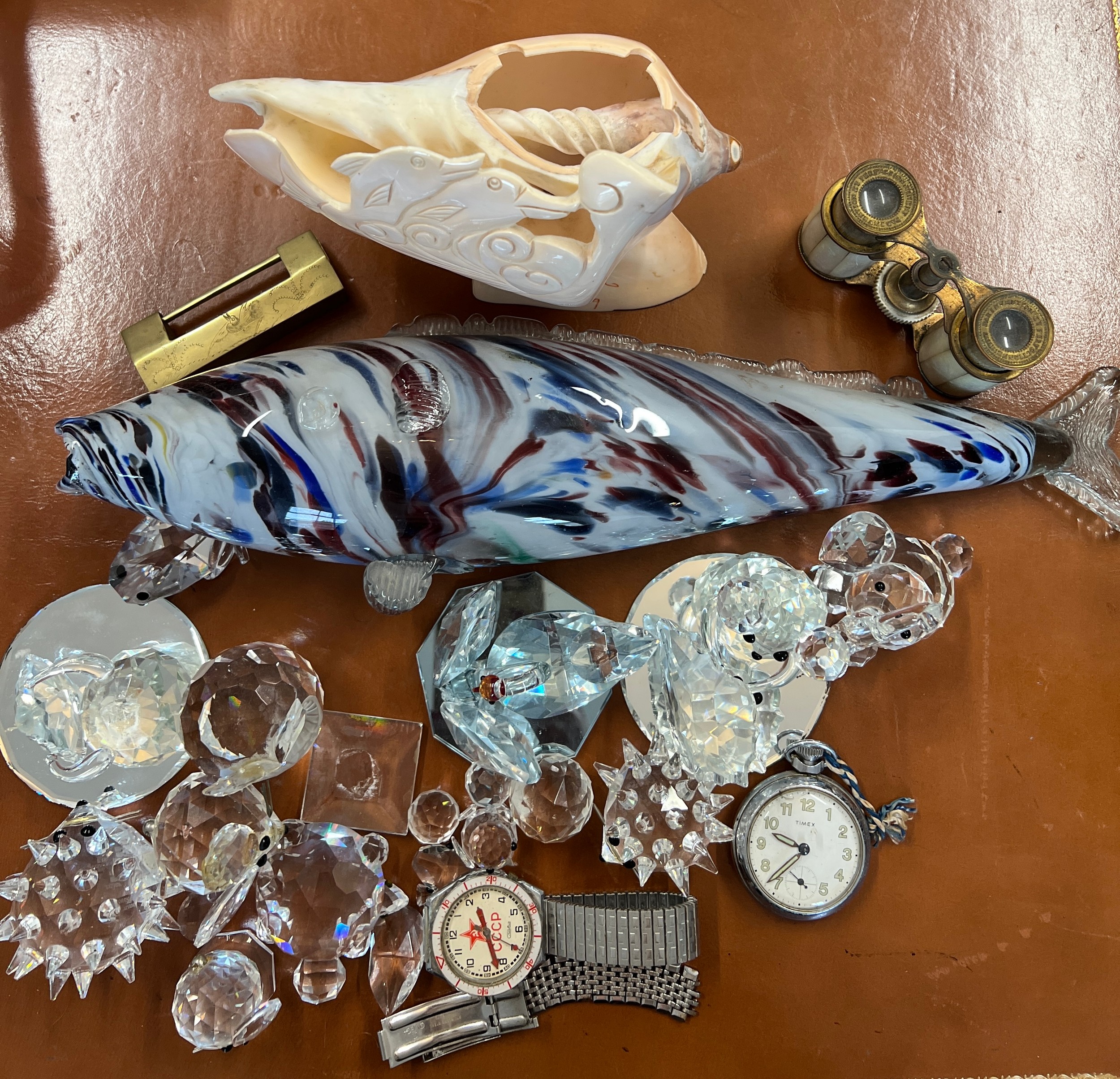 A miscellaneous lot to include Timex pocket watch, CCCP wristwatch, Swarovski animals, a glass fish