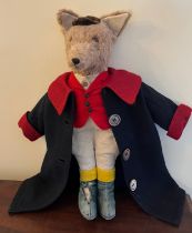 A vintage toy fox in hunting attire. 43cm h.