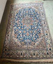 Hand knotted silk Persian rug. 190cm l x 119cm w.