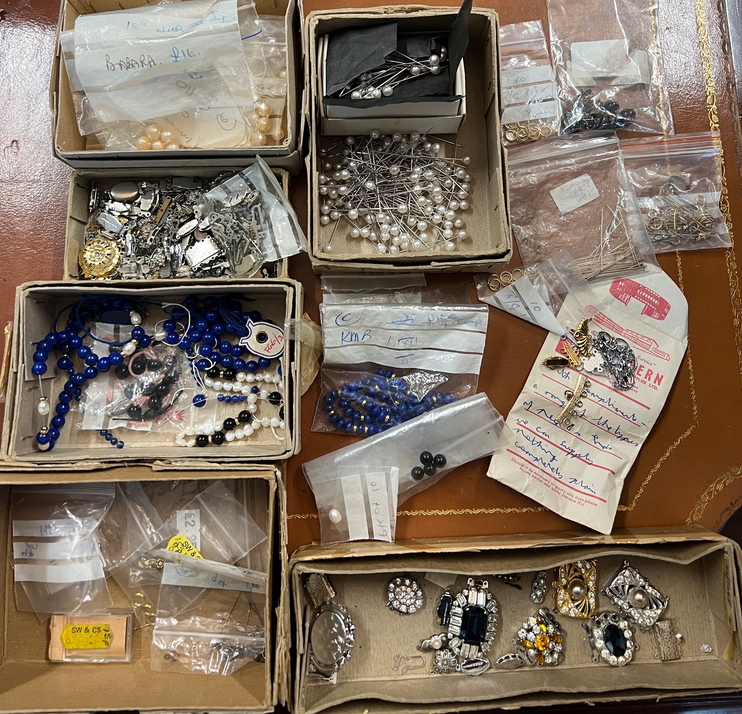A quantity of jewellery fastenings, loose beads including lapis etc.