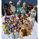 A collection of various dolls to include vintage tourist dolls, Corolle, Leonardo etc together