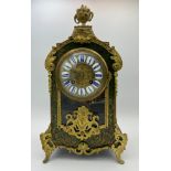 A 19thC ornate boulle mantel clock with gilt metal mounts. 37cm h. Strikes on both the hour and half