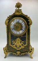 A 19thC ornate boulle mantel clock with gilt metal mounts. 37cm h. Strikes on both the hour and half