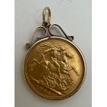 A 1906 full sovereign mounted in 9 carat gold with suspension ring. Total weight 9.2gm.
