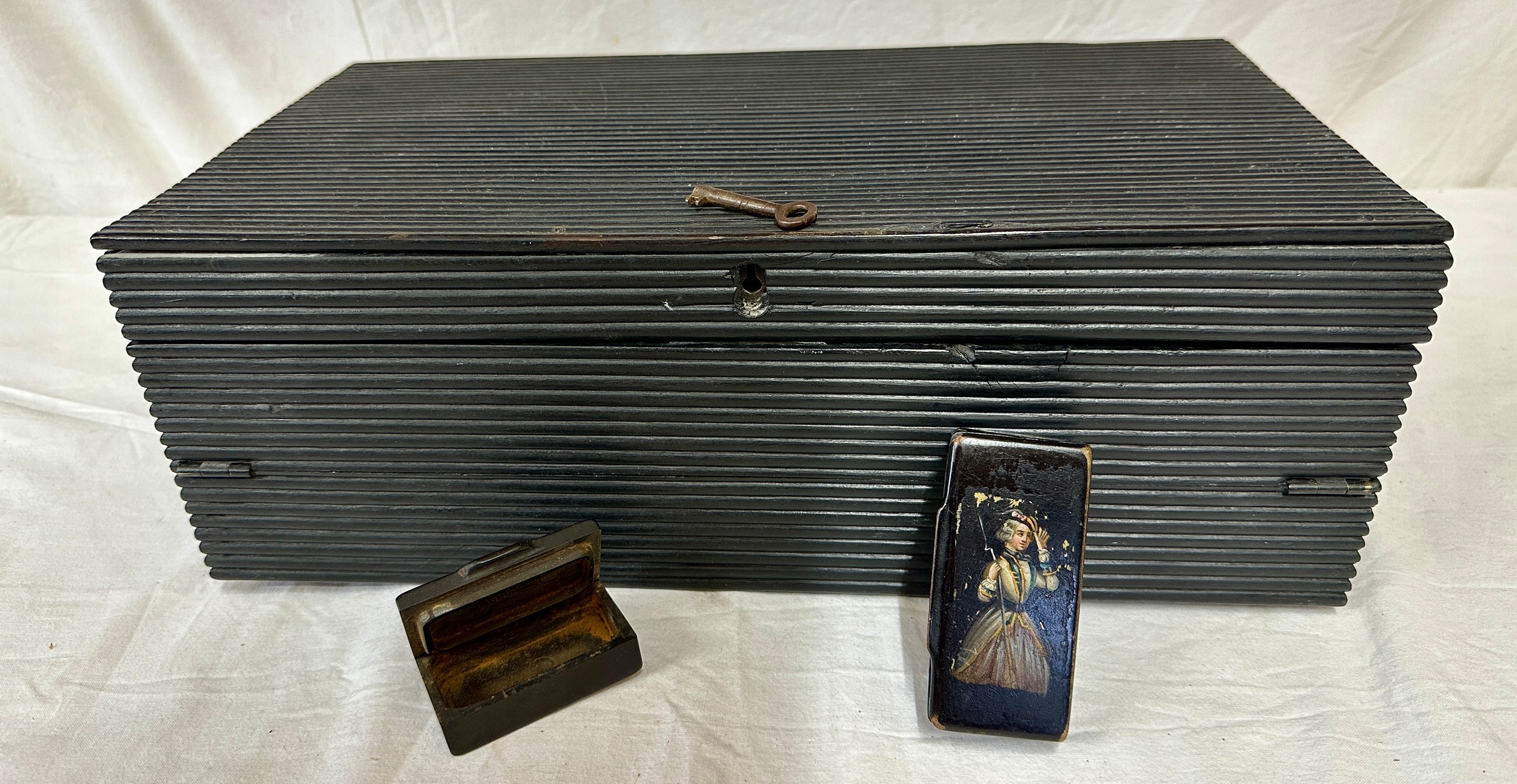 A 19thC ebonised combination writing slope box with a reeded ebony case, fitted interior, three
