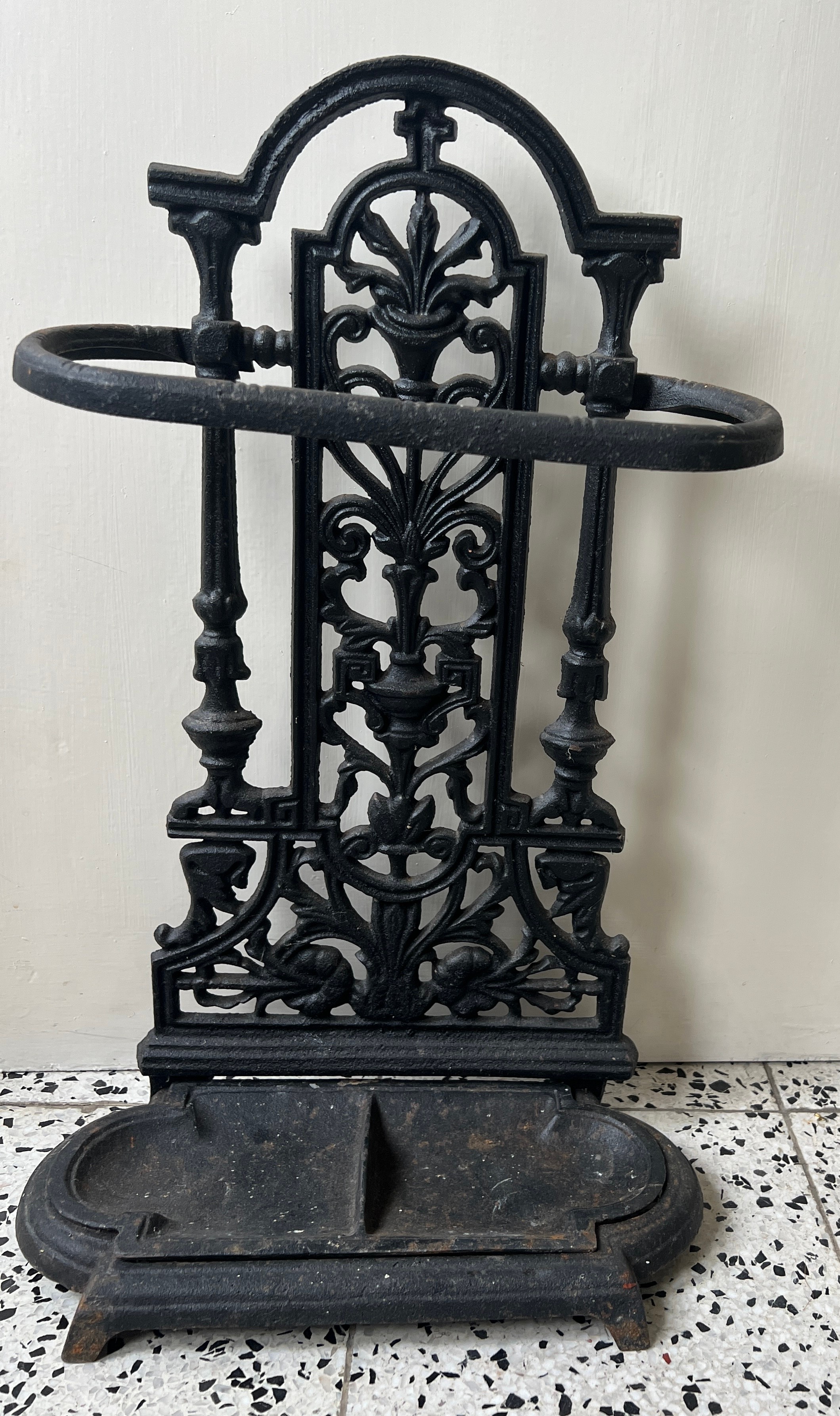 A cast iron stick stand. 51cm h x 33cm w.