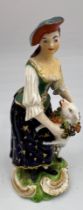 An 18thC figure of a shepherdess, 13.5cm h. Marked N 40 to base.