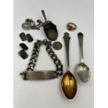 A quantity of hallmarked and .925 silver to include caddy spoon, identity bracelet, spoons,