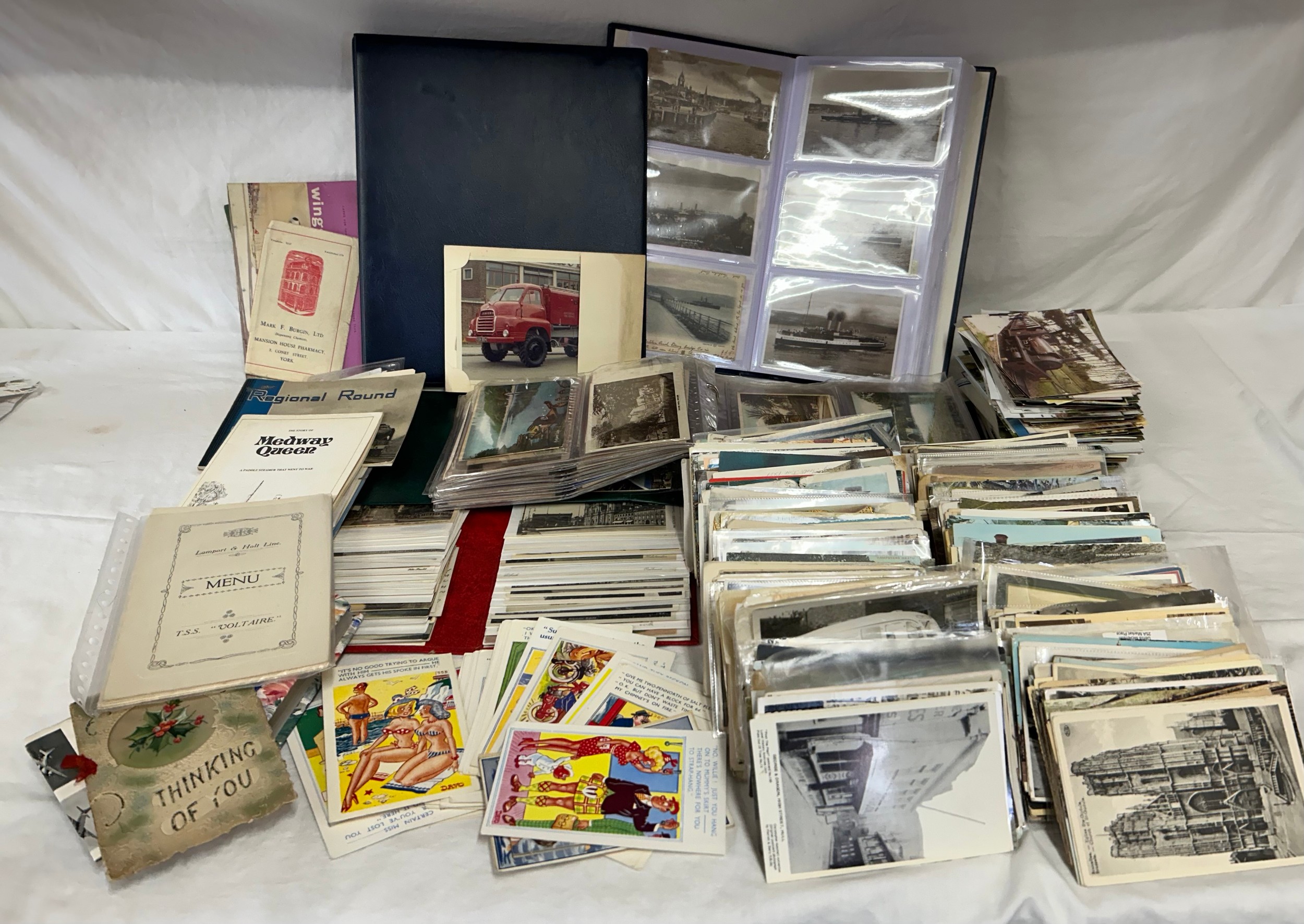 A large quantity of postcards (1500+) in 4 albums relating to Ships/Boats, Trains & Railway, seaside