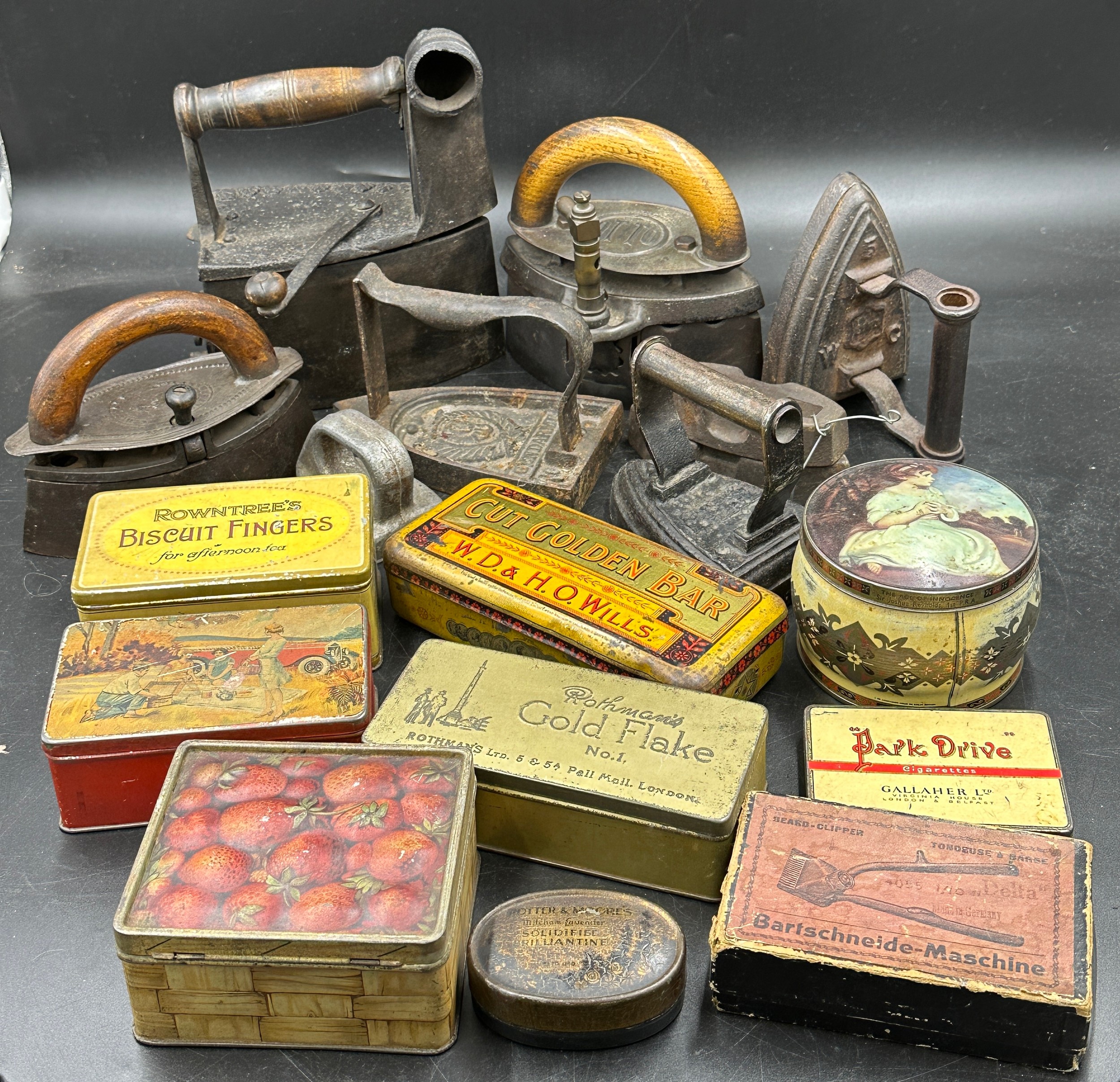 A collection of sad irons, CH Crane, Otto etc together with various tins to include Rowntree's - Image 2 of 10