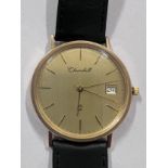 A gentleman's 9ct gold Churchill wristwatch on black leather strap with a spare strap. In original