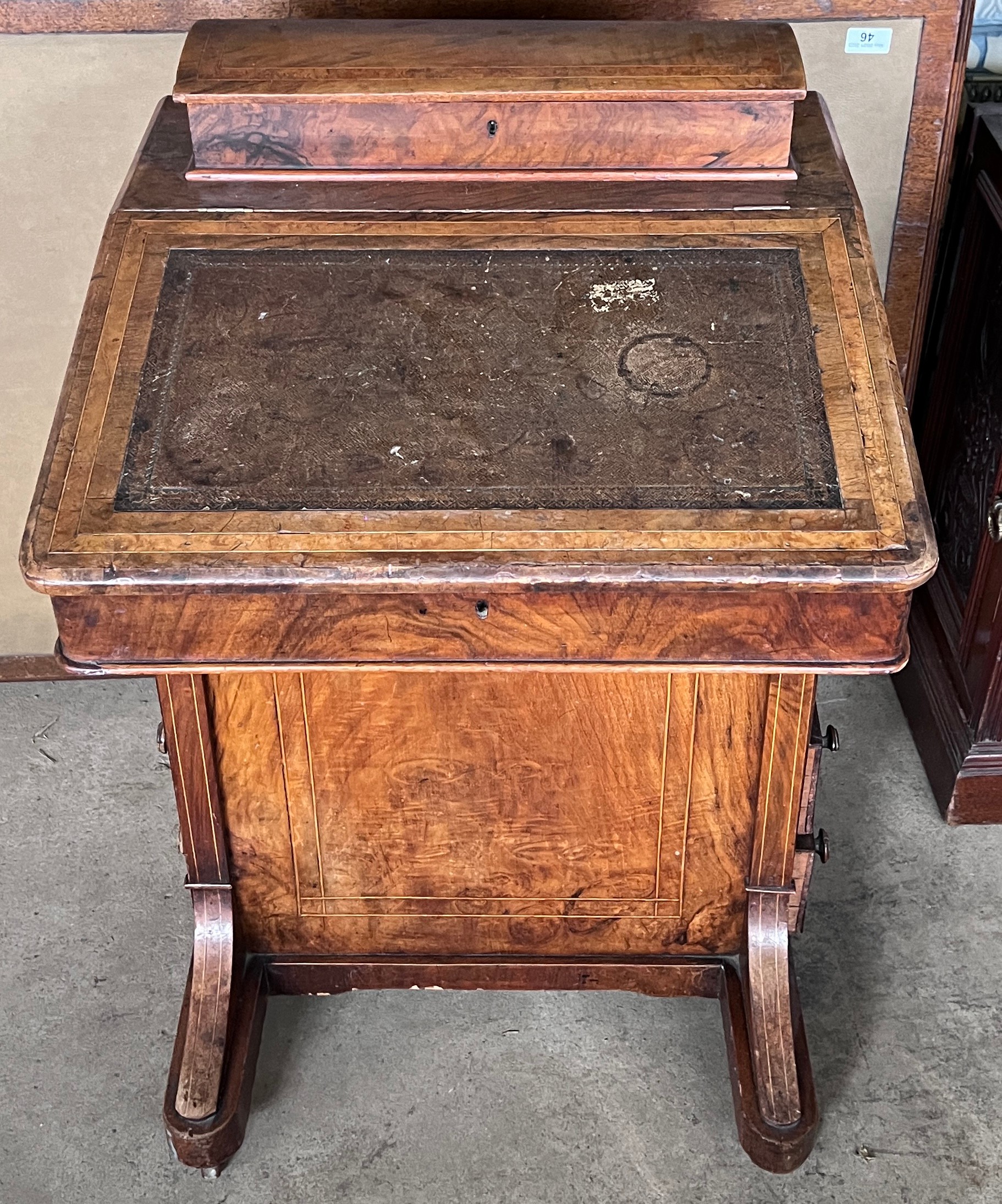 A 19thC walnut Davenport desk with bird’s eye maple interior. 81cm h x 53cm w x 54cm d.