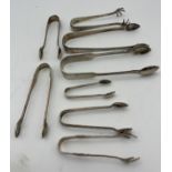 Eight hallmarked silver sugar tongs various dates and makers to include Exeter 1878, maker Josiah
