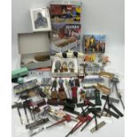 A collection of various miniature railway accessories to include model train metal railway signs,