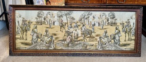 A large early 19thC machine made tapestry-style picture of a Middle Eastern market/street scene in a