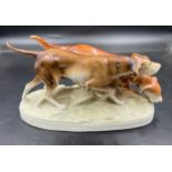 A mid-20th century Royal Dux porcelain figure group of two hunting dogs, 36cm w.