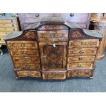 An 18thC Austrian parquetry/marquetry inlaid table top cabinet with multiple drawers and central