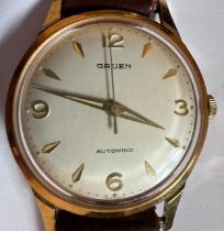 A vintage 1960's automatic Gruen Autowind with luminous dial and gold plated bezel, sweeping