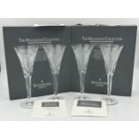 Two boxed pairs of Waterford crystal champagne flutes from 'The Millennium 2000 Collection', 23.