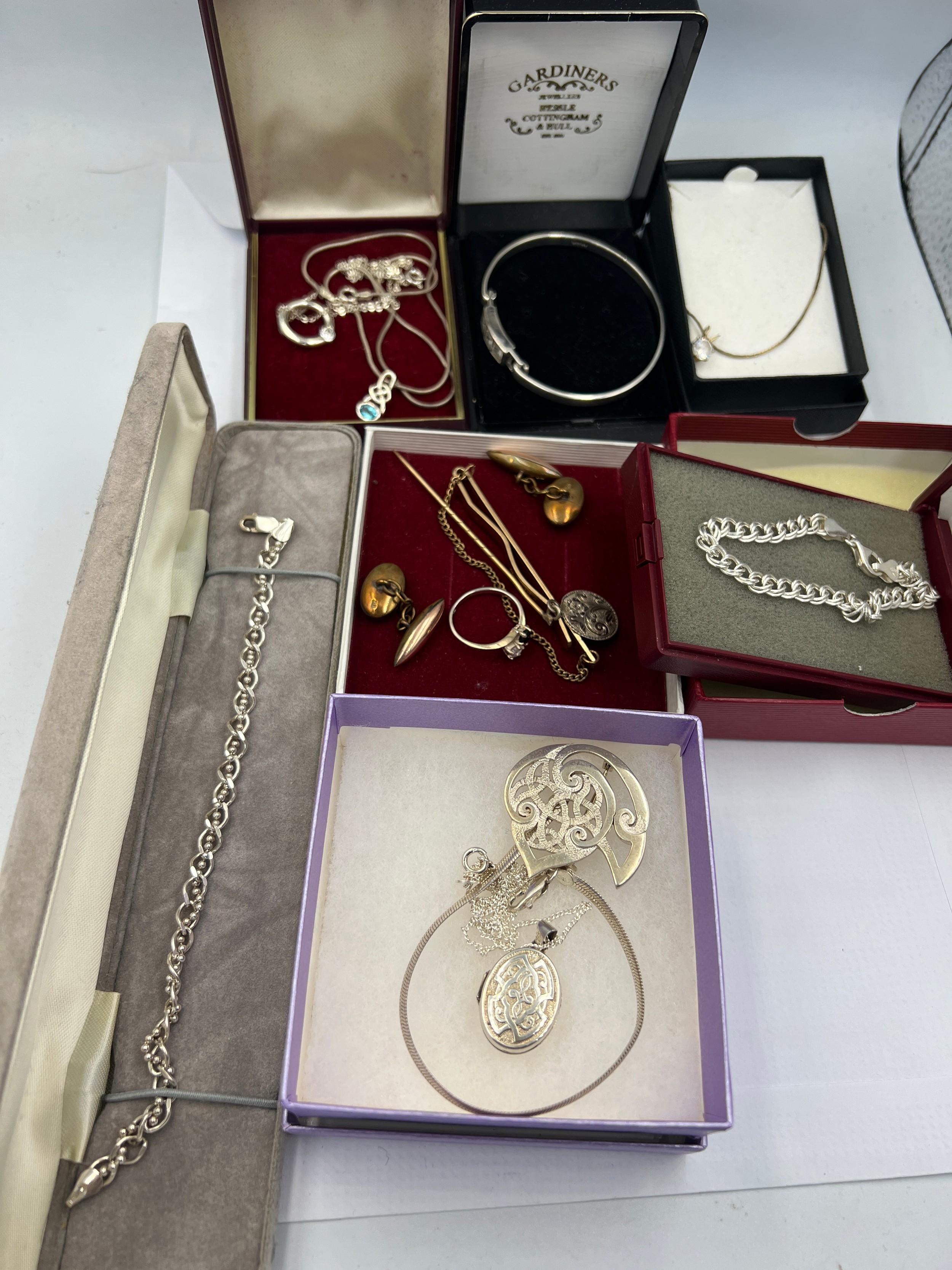 A quantity of silver and rolled gold jewellery to include bangles, pendants, watch chain etc.