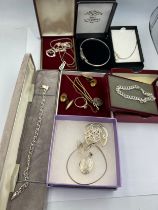 A quantity of silver and rolled gold jewellery to include bangles, pendants, watch chain etc.