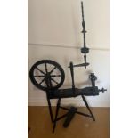 A late 19thC ebonised spinning wheel. 136cm h.