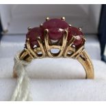 A 9 carat yellow gold ring set with pink and clear stones. Size K, weight 2.8gm.