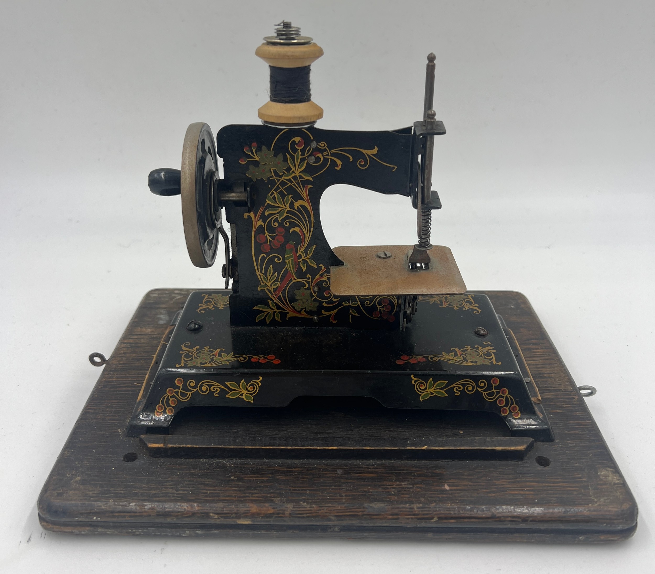 A child’s metal sewing machine in an oak Edison case. 25cm w x 22cm h. - Image 2 of 3
