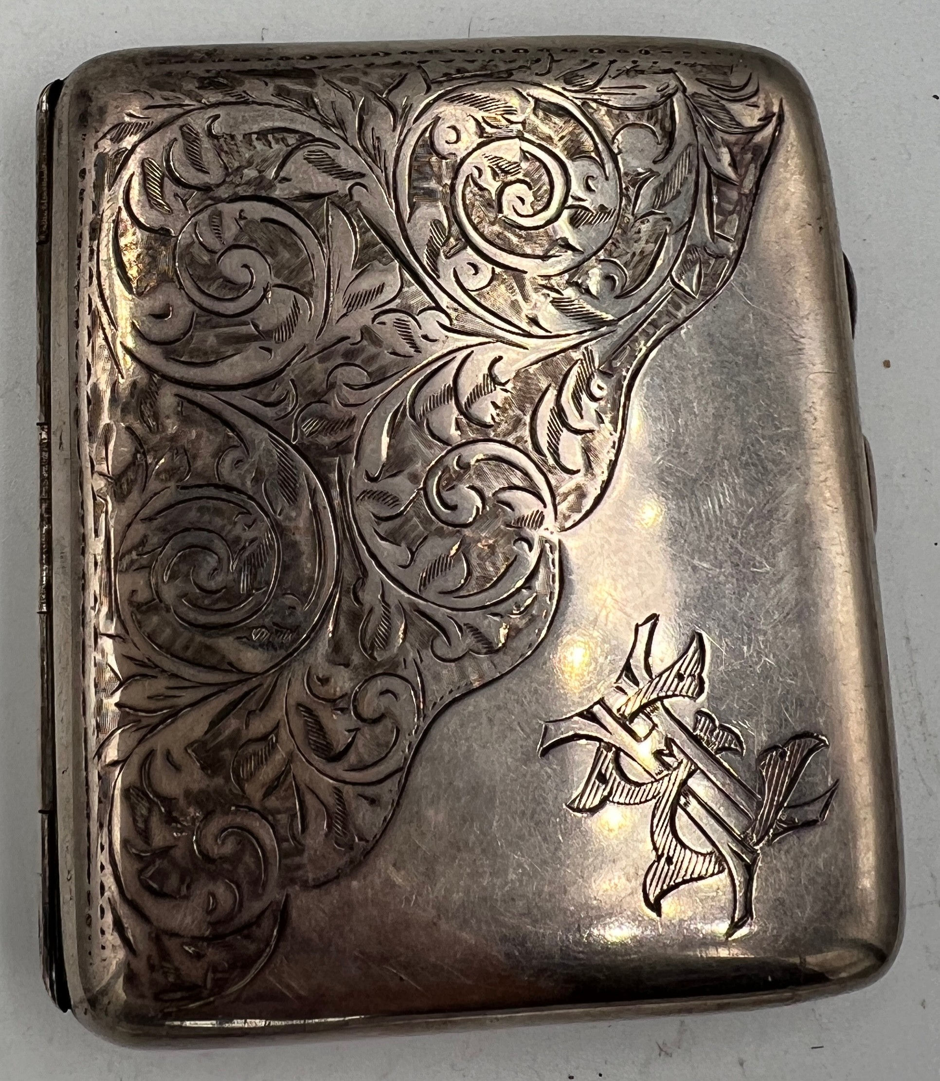 A hallmarked silver cigarette case. Birmingham 1917, maker Joseph Gloster Ltd. Weight 87gm.