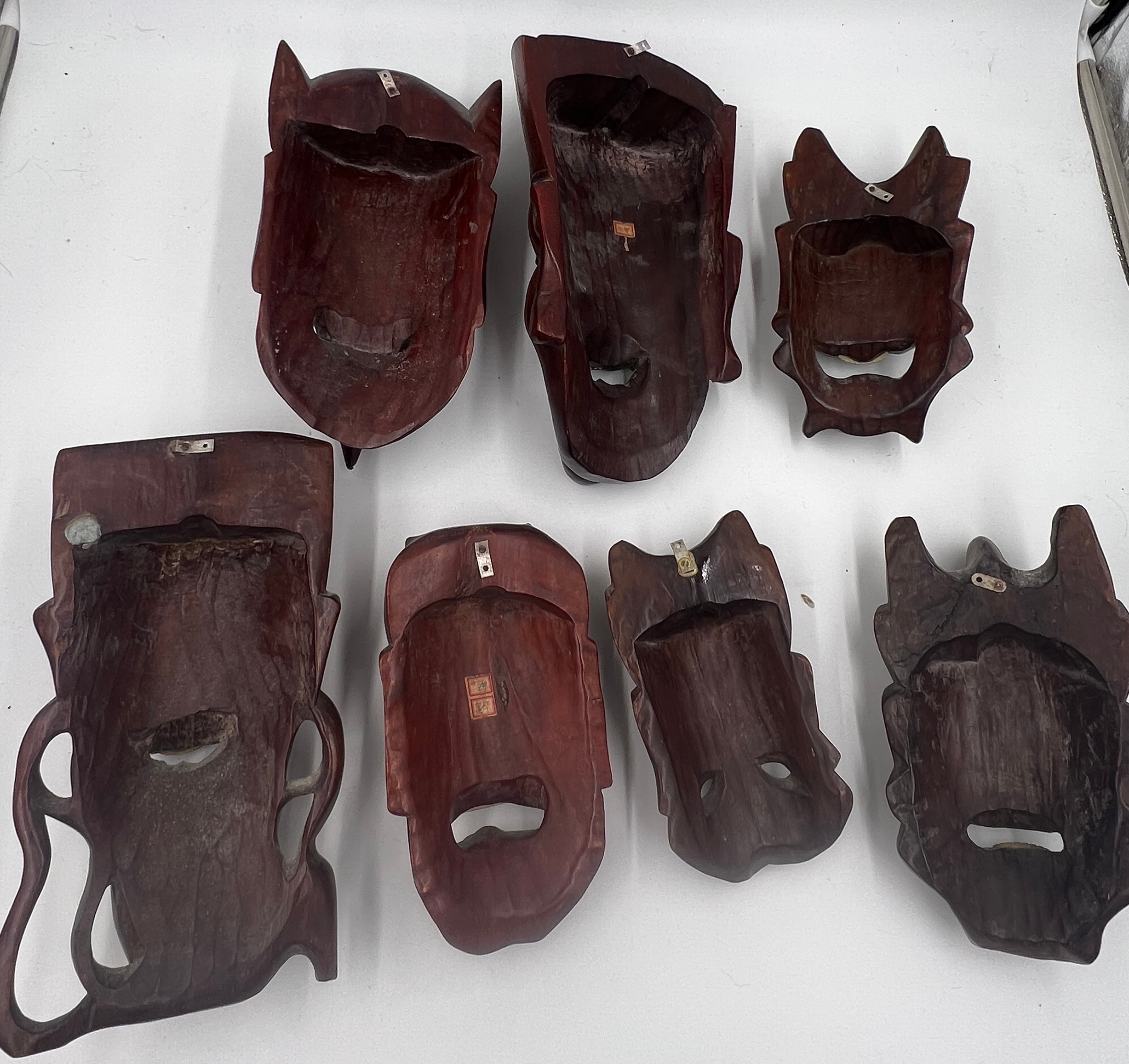 Seven various oriental hardwood masks. Largest 29cm l. - Image 3 of 3