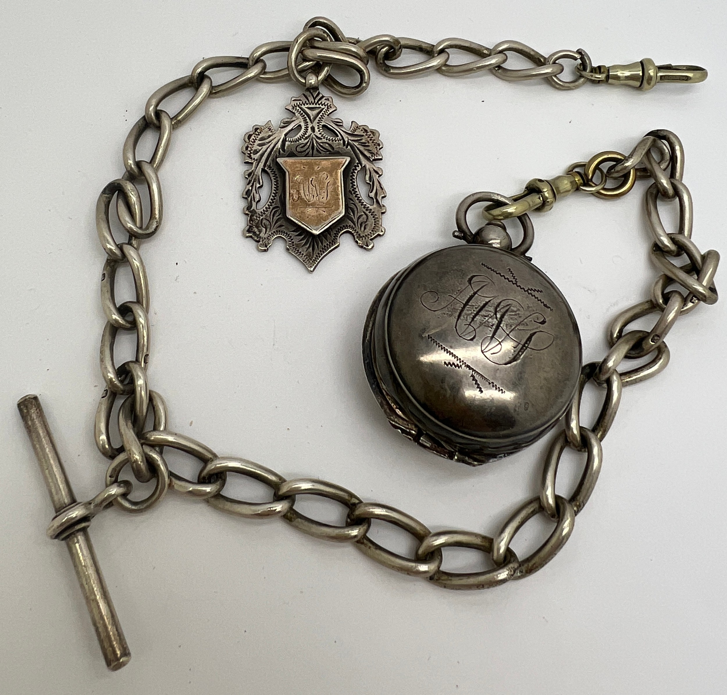 Hallmarked silver watch chain with medal fob, sovereign case and T bar. All links marked.Total