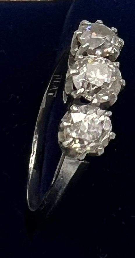 A three stone diamond ring mounted in platinum. Size K. Weight 3.5gm. Approximate diamond - Image 4 of 7