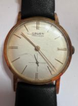 A Gruen Precision wristwatch with subsidiary seconds dial on black leather strap. Good working