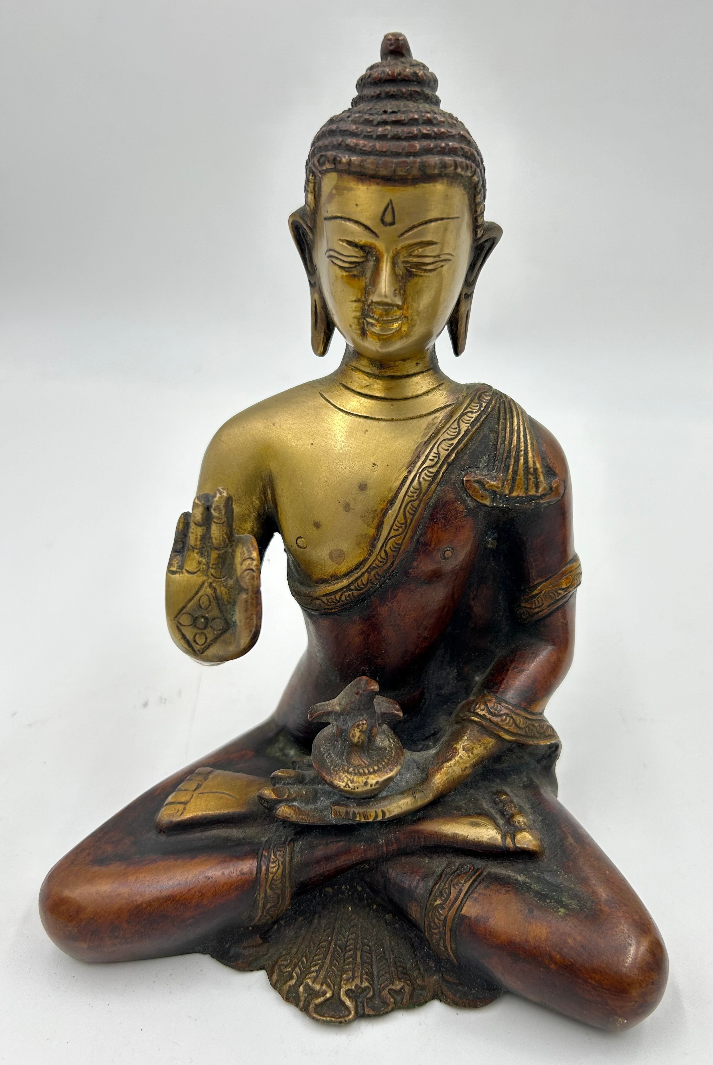 A Tibetan bronze seated figure of Green Tara 22cm h together with a heavy brass hand crafted meditat - Image 6 of 9