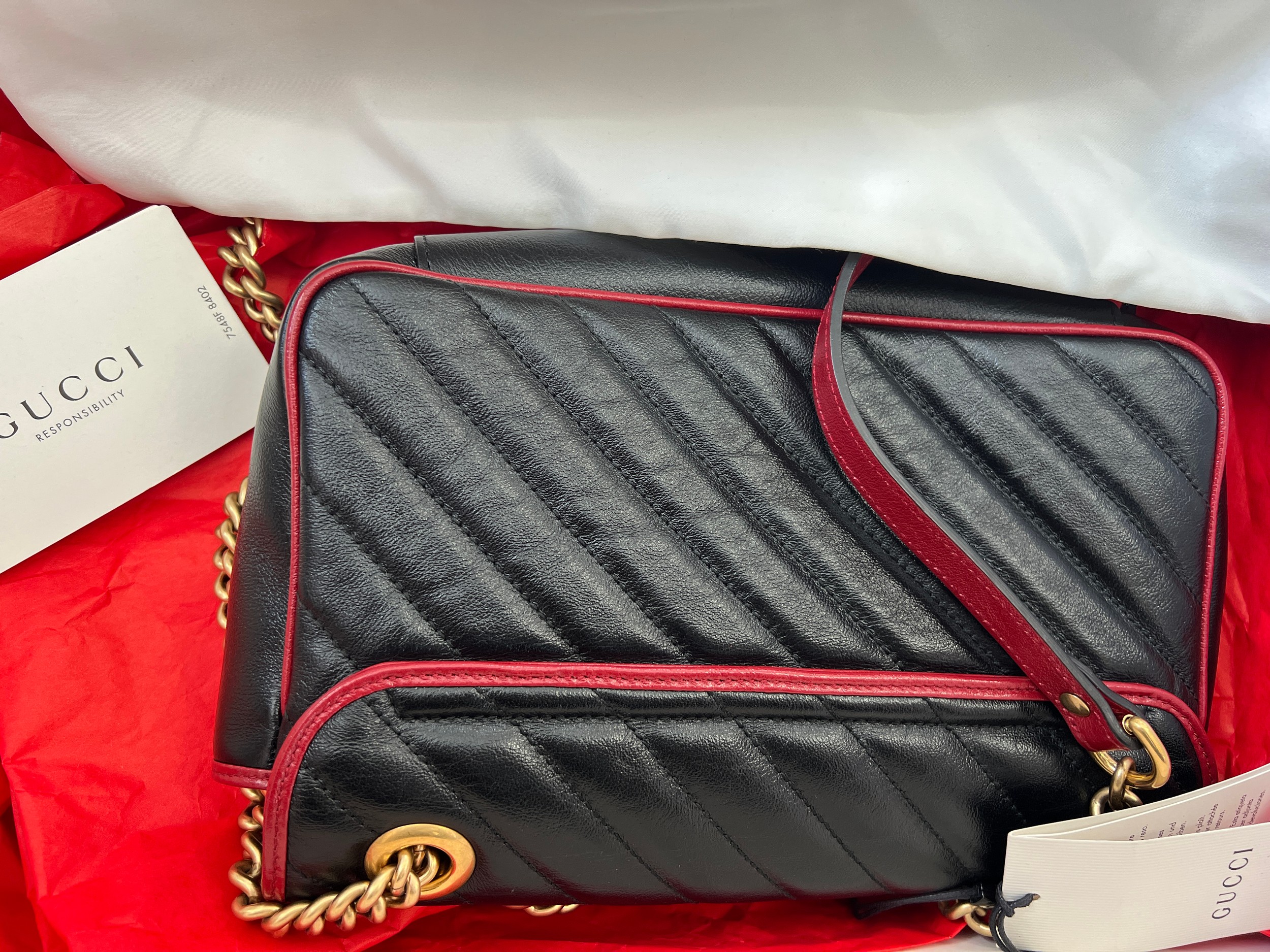 A Gucci Marmont black with red trim and gold coloured chain hand bag, together with original box and - Image 4 of 9