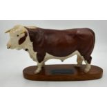 A Beswick Hereford Bull, Connoisseur model on mount. Ht 18cm, mount 30cm l.