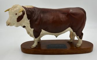 A Beswick Hereford Bull, Connoisseur model on mount. Ht 18cm, mount 30cm l.