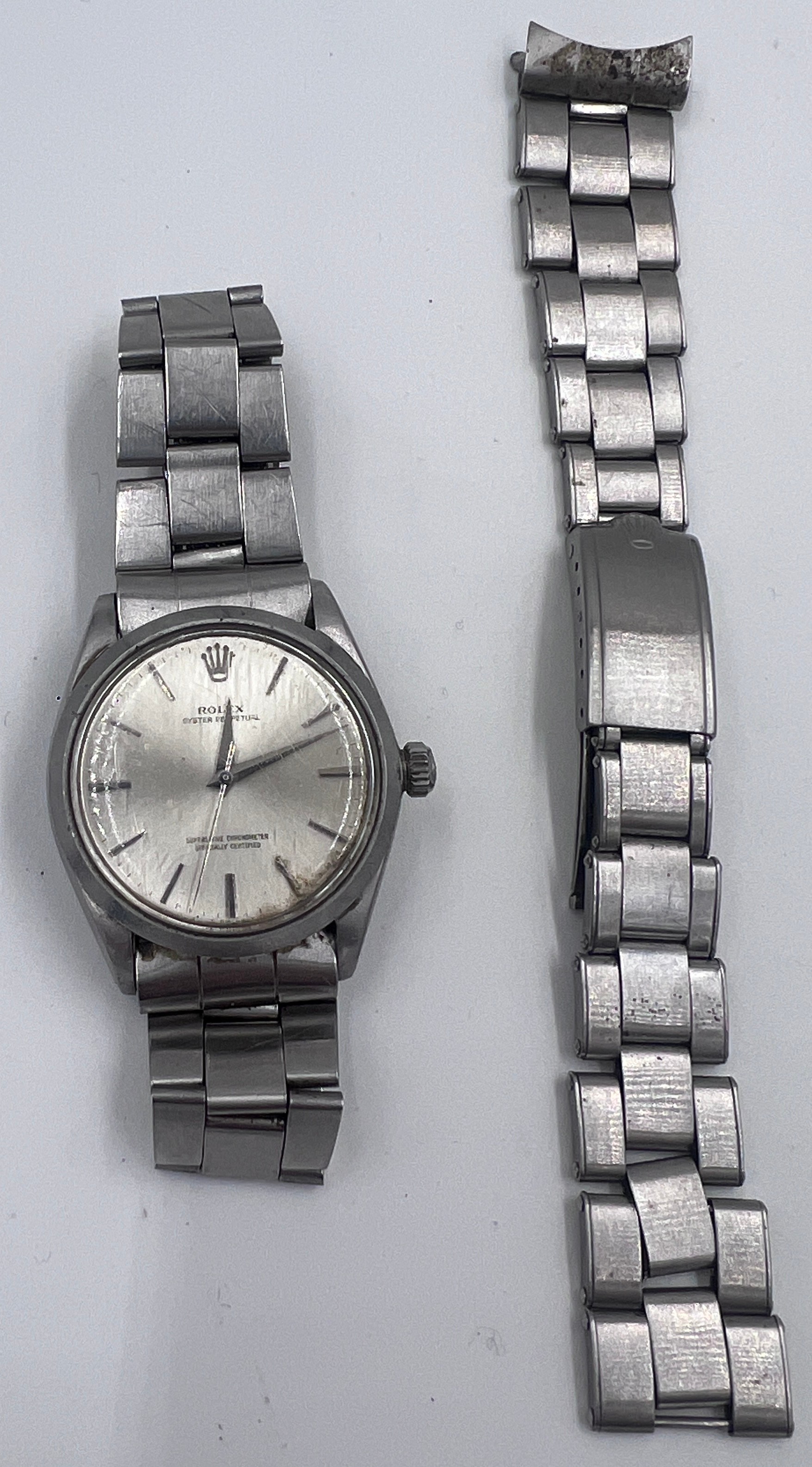 A 1964 Rolex Oyster Perpetual wristwatch on Rolex Stainless steel bracelet. Model: 1002. Ref: