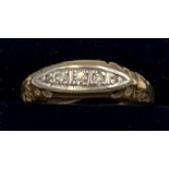 An 18 carat gold and platinum ring set with diamonds. Size M. Weight 1.8gm.