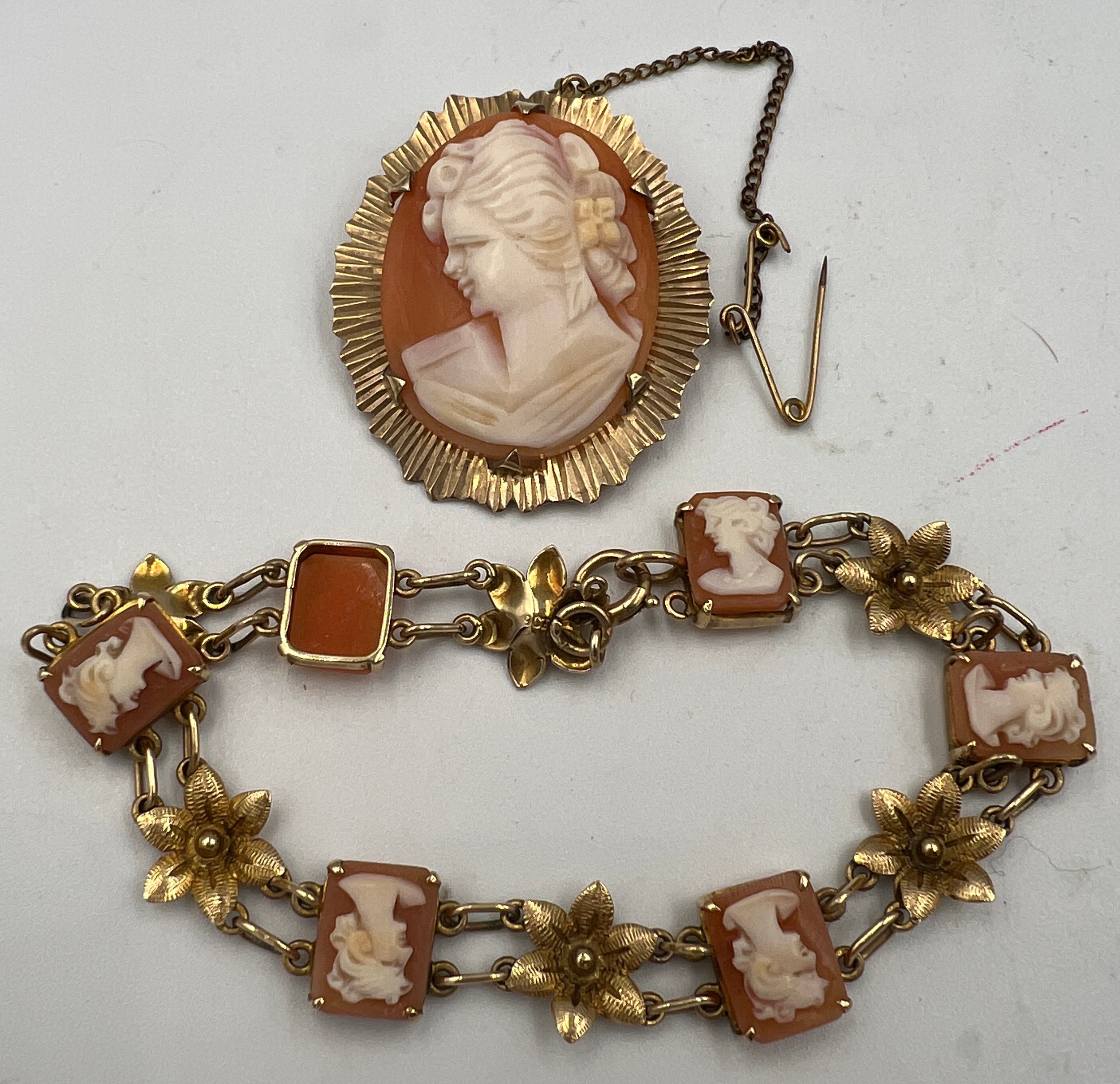 A shell cameo brooch and bracelet mounted in 9 carat yellow gold. Total weight 16.1gm.